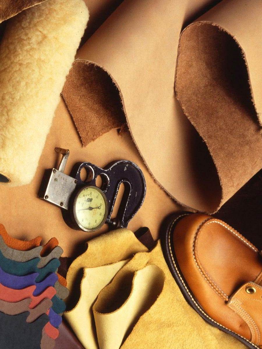 Sheepskin beside finished leather and a thickness gauge